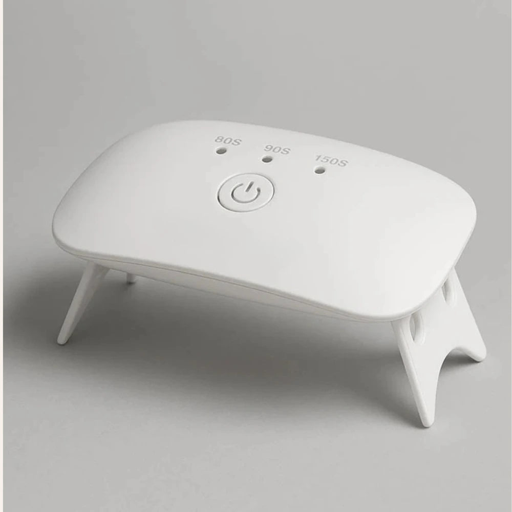 White electronic device with buttons on a gray background