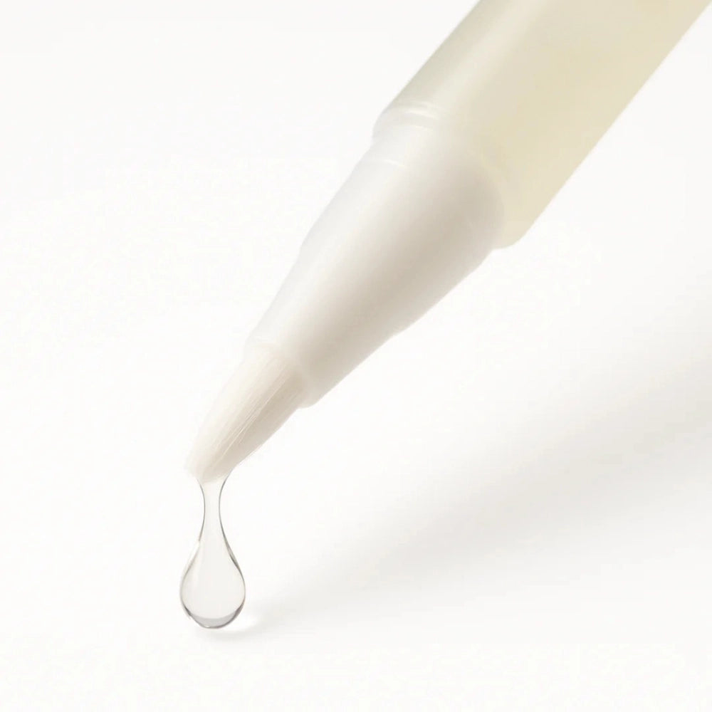 Cylindrical container with a dropper dispensing a clear liquid on a white background